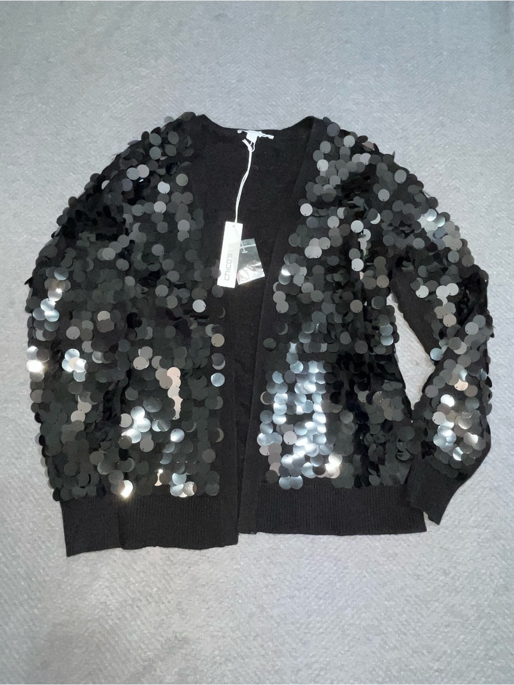 NWT black Chico's cardigan adorned w/ oversized, shimmering sequins. Size 0.